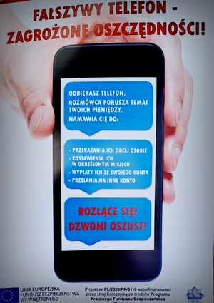 Plakat na którym widać telefon z ostrzeżeniami przed fałszywym wnuczkiem
